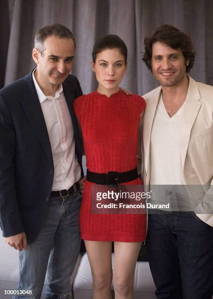 Director Olivier Assayas, actress Nora Von Waldstatten and actor Edgar Ramirez attends the "Carlos" portrait session at the Audi Beach during the...