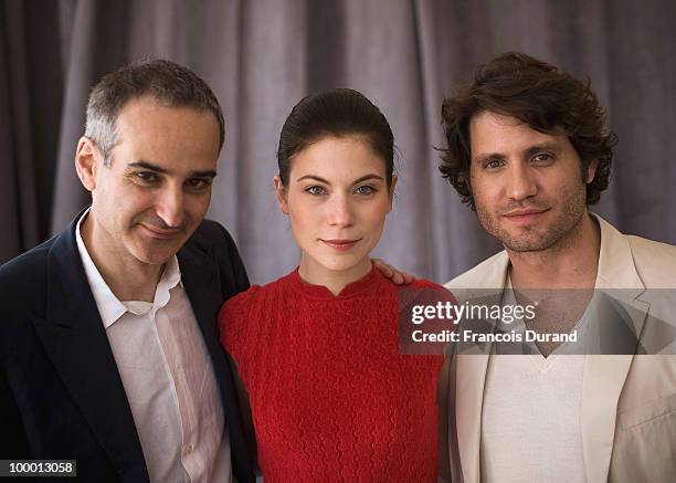 Director Olivier Assayas, actress Nora Von Waldstatten and actor Edgar Ramirez attends the "Carlos" portrait session at the Audi Beach during the...