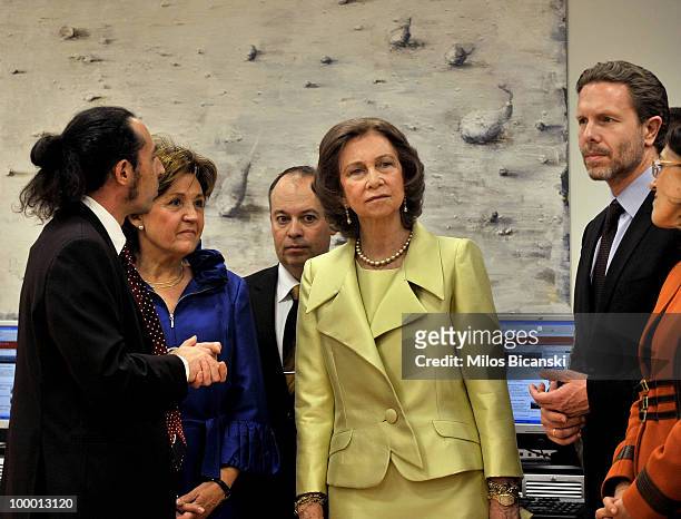 Queen Sofia of Spain talks with Greek Culture Minister Pavlos Geroulanos and chairman of Cervantes Institute Eusebi Ayensa Prat while they visit the...
