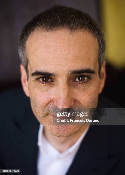 Director Olivier Assayas attends the "Carlos" portrait session at the Audi Beach during the 63rd Annual Cannes Film Festival on May 20, 2010 in...