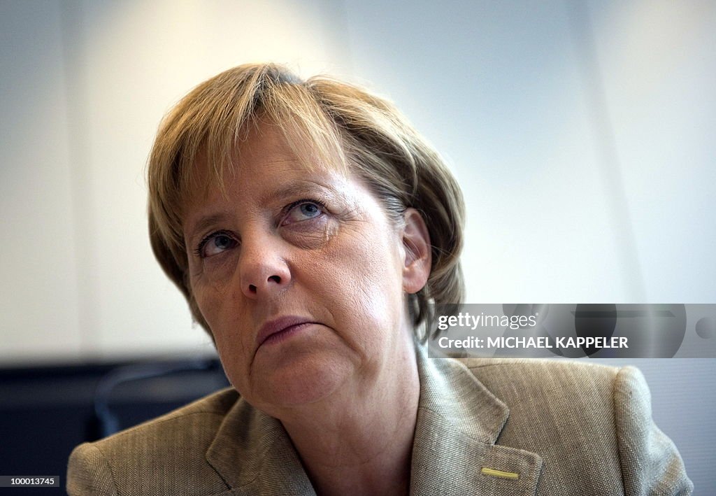 German Chancellor Angela Merkel waits fo
