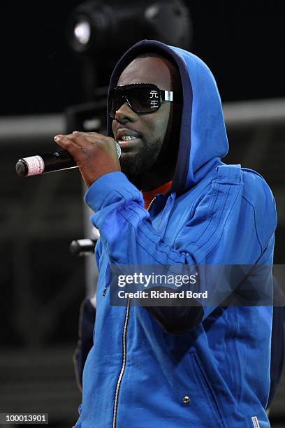 Maitre Gim's of Sexion d'Assaut rap group sings at the World Charity Soccer 2010 Charity Match for Haiti at Stade Charlety on May 19, 2010 in Paris,...