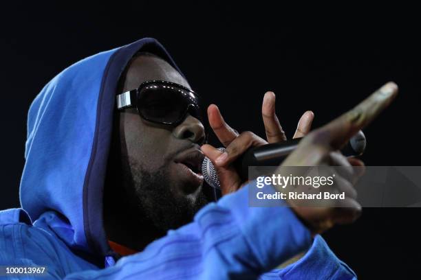 Maitre Gim's of Sexion d'Assaut rap group sings at the World Charity Soccer 2010 Charity Match for Haiti at Stade Charlety on May 19, 2010 in Paris,...