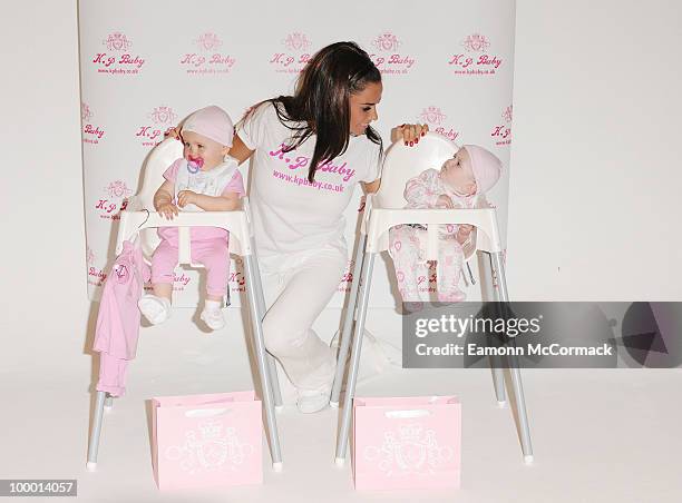 Katie Price attends photocall to launch her new range of Baby Clothes - KP BABY on May 20, 2010 in London, England.