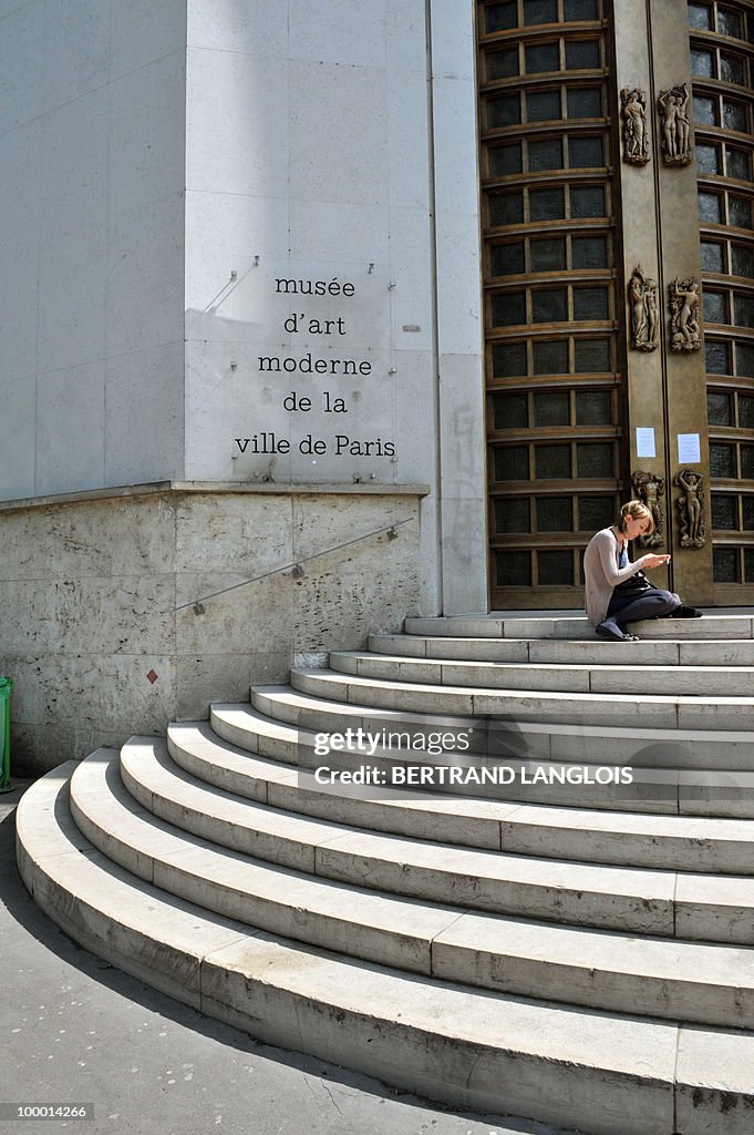 A woman sits on May 20, 2010 on the stai