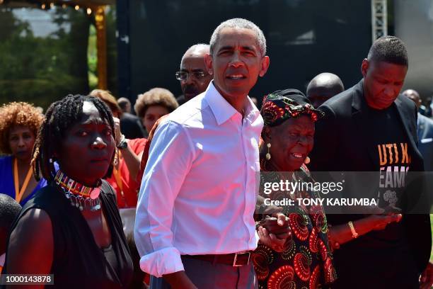 Former US President, Barack Obama with his step-grandmother Sarah and half-sister, Auma arrive to unveil a plaque on July 16, 2018 during the opening...