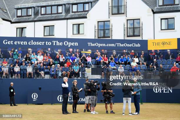 Jordan Spieth of the United States, winner of the 146th Open Championship, interviewed after carrying the Claret Jug onto the first tee as he returns...