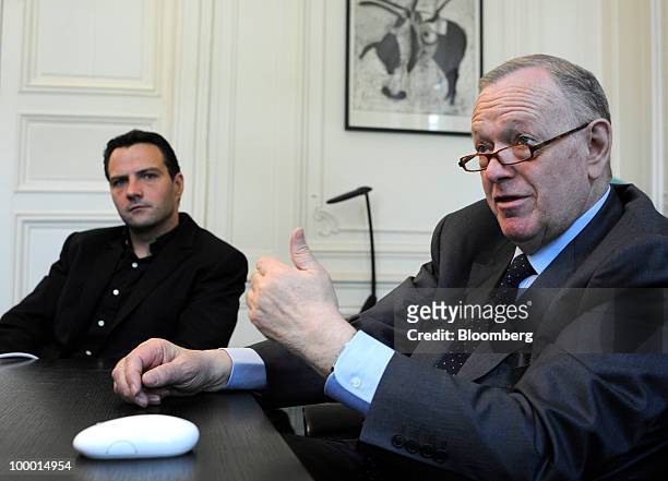 Jerome Kerviel, former Societe Generale trader, left, listens as his lawyer, Olivier Metzner, speaks in Metzner's office in Paris, France, on...