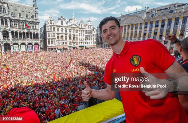 Belgian soccer team player Thibaut Courtois celebrates on the balcony of the city hall at the Brussels' Grand Place, after taking the third place in...