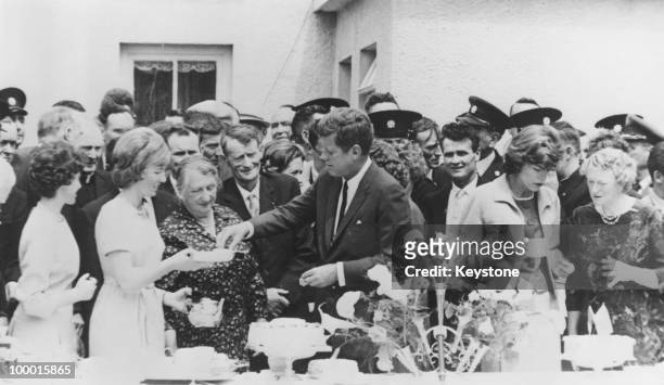 President John F. Kennedy attends a tea party in his ancestral town of Dunganstown, County Wexford, 27th June 1963. His great-grandfather Patrick...
