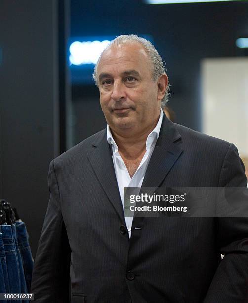 Sir Philip Green, the billionaire owner of Arcadia Group Ltd., center, walks through the new Topshop store in London, U.K., on Thursday, May 20,...