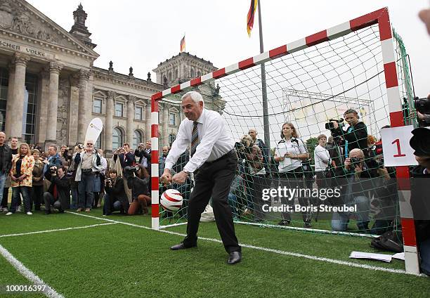 Karl Rothmund, vice president of the German Football Association and head of the Sepp-Herberger-Stiftung holds a penalty on the 'Day of Blind...