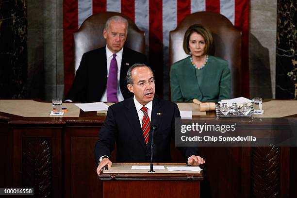 Mexican President Felipe Calderon addresses a joint session of the U.S. Congress on the floor of the House House of Representatives with Vice...