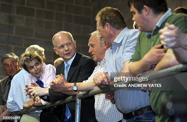 Foreign Secretary William Hague meets local farmers during a cattle auction at the Thirsk rural business centre in Thirsk, north Yorkshire, England...