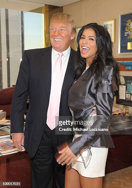 Donald Trump welcomes Miss USA 2010 Rima Fakih to his office in Trump Tower on May 20, 2010 in New York, City.