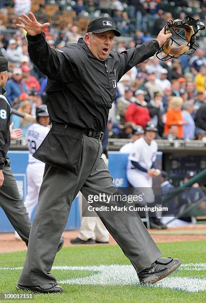 Home plate umpire Dale Scott motions no home run after reviewing a disputed call on Brandon Inge of the Detroit Tigers home run in the sixth inning...