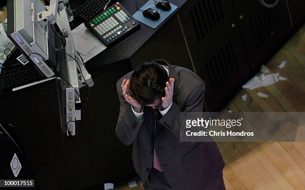 Financial professional gestures on the floor of the New York Stock Exchange in the middle of the trading day May 20, 2010 in New York City. Stocks...