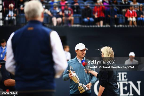 Jordan Spieth of the United States, winner of the 146th Open Championship, is interviewed with the Claret Jug on the first tee as he returns it...