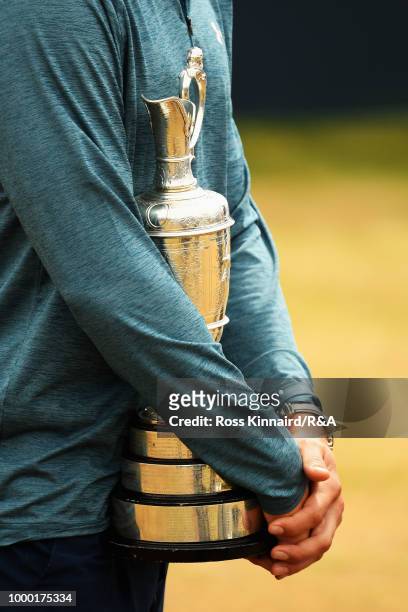 Jordan Spieth of the United States, winner of the 146th Open Championship holds the Claret Jug on the first tee as he returns it during previews to...
