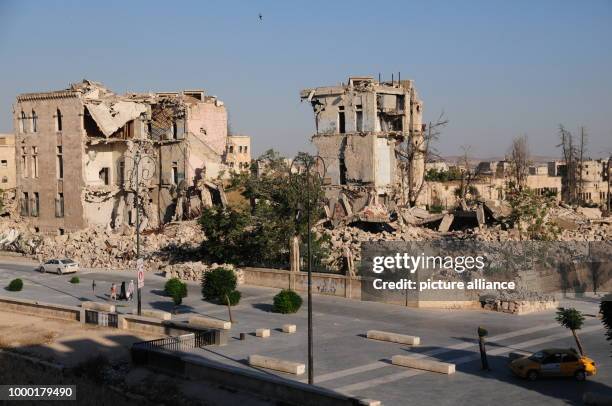 Partially and completely destroyed buildings surrounding the citadel of Aleppo can be seen in this picture taken 24 June 2017. According to the UN,...