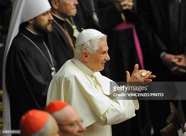 Pope Benedict XVI applauds flanked by Methropolite Hilarion Alfeyev at the end of the concert offered by Russian Patriarch Kirill I in the Paolo VI...