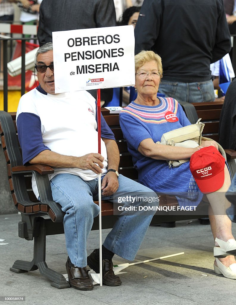 A demonstrator holds a placard during a