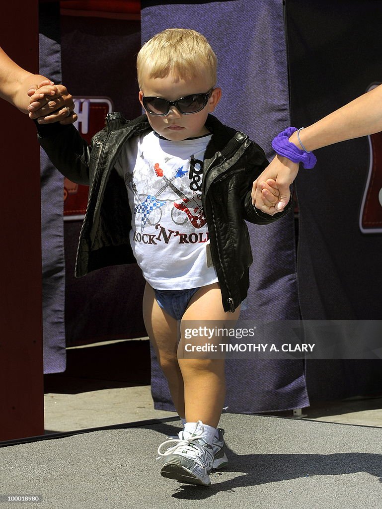 A toddler shows off the new Huggies Litt