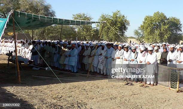 Relatives and followers of a Pakistani cleric Maulana Mirajuddin, offer funeral prayers in front of his coffin at Gomal village, near Tank town on...