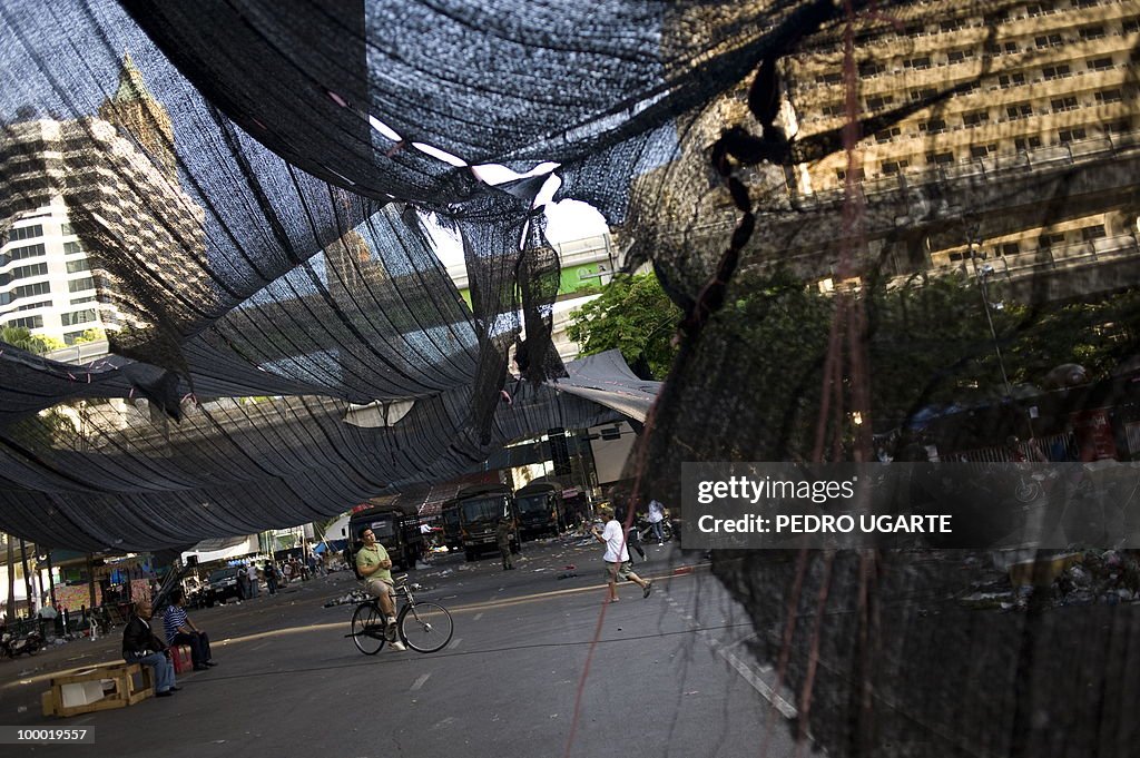 A Thai man stands stands in the place wh