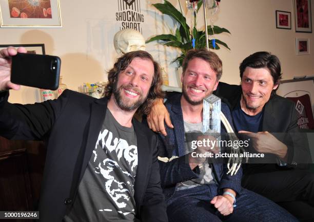 The young director and winner Josef Brandl and the judges Oliver Korittke and Stipe Erceg take a selfie after the award ceremony of the Shocking...