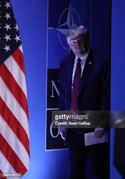 President Donald Trump arrives to speak to the media at a press conference on the second day of the 2018 NATO Summit on July 12, 2018 in Brussels,...