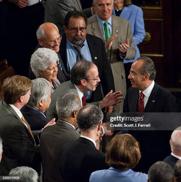 May 20: Rep. Eliot Engel, D-N.Y., shakes hands as other members wait to greet Mexican President Felipe Calderon after Calberon addressed a joint...