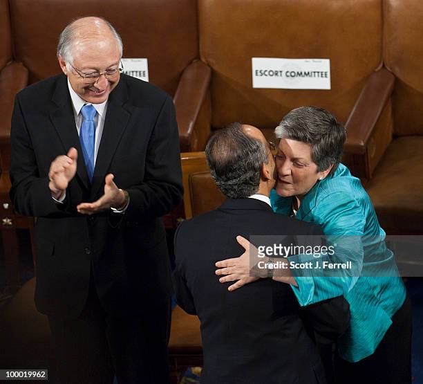 May 20: As Interior Secretary Ken Salazar looks on, Homeland Security Secretary Janey Napolitano hugs Mexican President Felipe Calderon as he arrives...