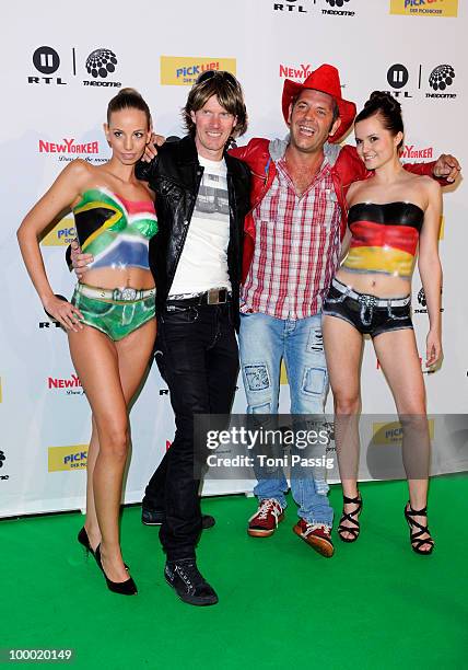 Singers Mickie Krause and Markus Becker pose with bodypainted models at 'The Dome 54' at Schleyerhalle on May 20, 2010 in Stuttgart, Germany.