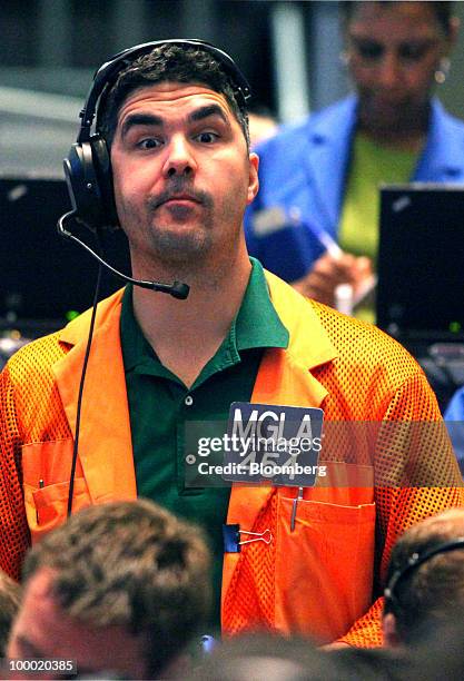Trader Peter Kosanovich awaits an order while working in the Eurodollar options trading pit at CME Group Inc.'s Chicago Board of Trade in Chicago,...