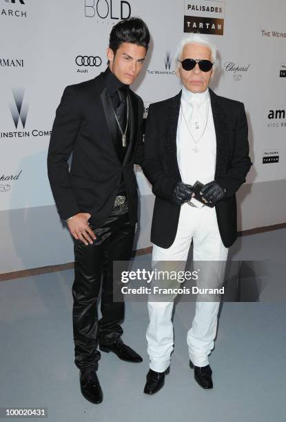 Baptiste Giabiconi and Karl Lagerfeld arrive at amfAR's Cinema Against AIDS 2010 benefit gala at the Hotel du Cap on May 20, 2010 in Antibes, France.