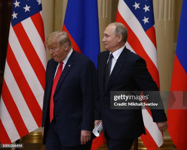 President Donald Trump and Russian President Vladimir Putin arrive for a joint press conference after their summit on July 16, 2018 in Helsinki,...