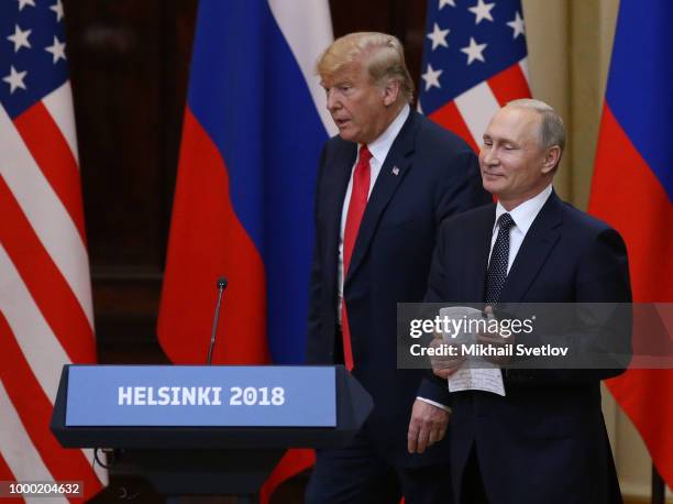 President Donald Trump and Russian President Vladimir Putin arrive for a joint press conference after their summit on July 16, 2018 in Helsinki,...