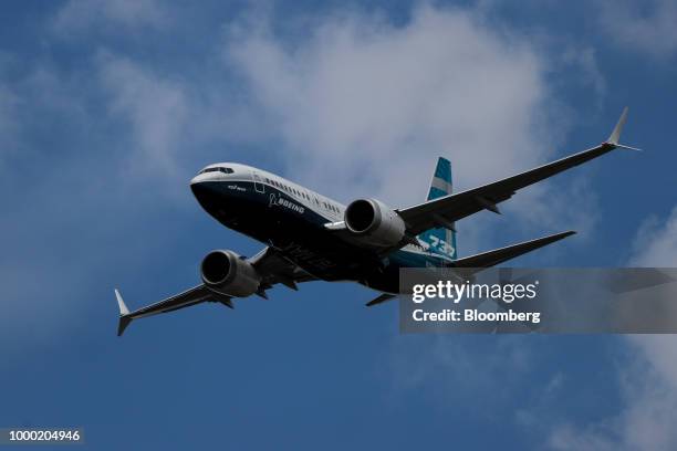 Boeing Co. 737 Max 7 jetliner flies during the flying display on the opening day of the Farnborough International Airshow 2018 in Farnborough, U.K.,...