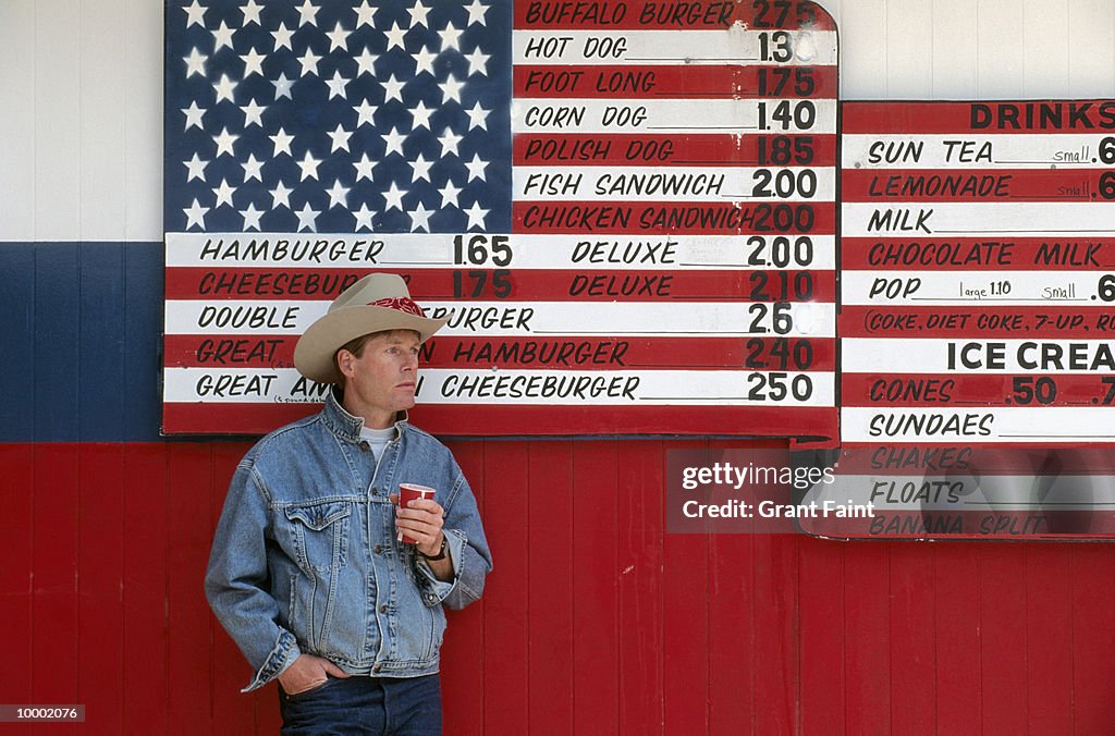 MAN IN HAT BY UNITED STATES FLAG MENU IN NORTH DAKOTA