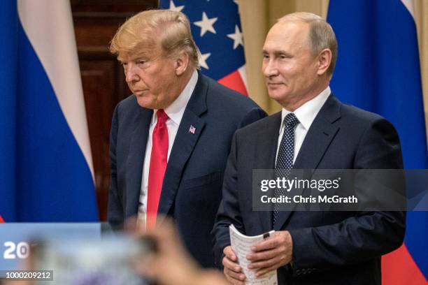 President Donald Trump and Russian President Vladimir Putin arrive to waiting media during a joint press conference after their summit on July 16,...