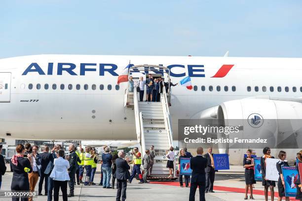 Didier Deschamps head coach, Noel Le Graet, president of French federation and Hugo Lloris of France with the trophy during the arrival at Airport...