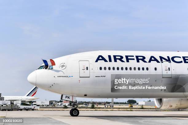 Pilot with the french flag during the arrival at Airport Roissy Charles de Gaulle on July 16, 2018 in Paris, France.