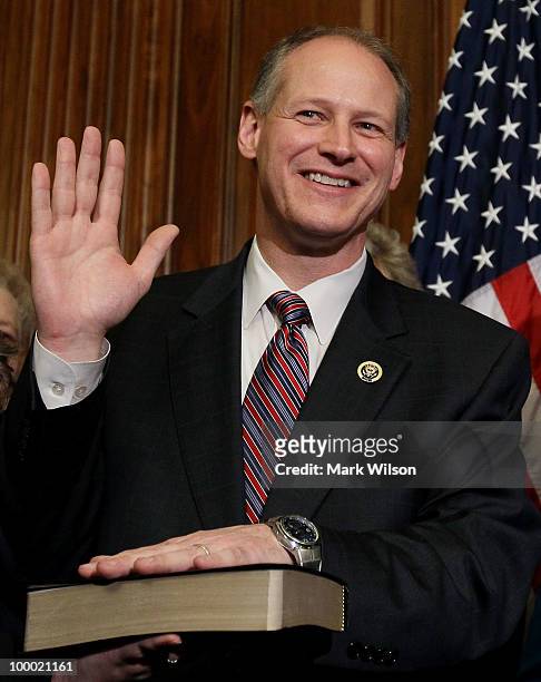Rep. Mark Critz participates in a mock swearing in moments after he was sworn in on the floor of the House on Capitol Hill May 20, 2010 in...