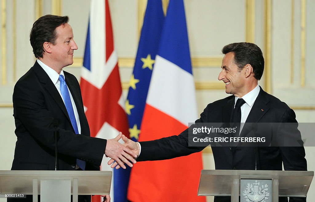 French President Nicolas Sarkozy (R) and