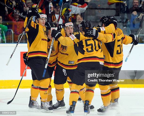 Players of Germany celebrates after Philip Gogulla scored the first goal during the IIHF World Championship quarter final match between Germany and...