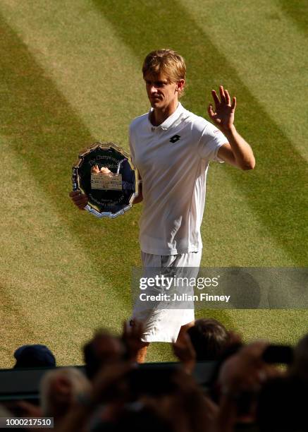 Kevin Anderson of South Africa with the runners up trophy after his loss to Novak Djokovic of Serbia during the Men's Singles final on day thirteen...