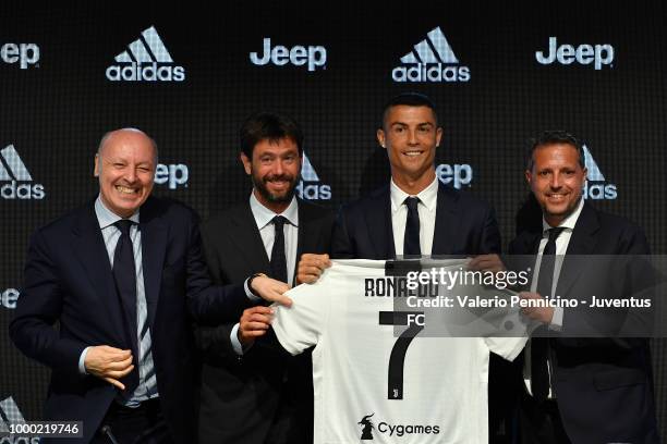 Juventus new signing Cristiano Ronaldo poses for the media with Giuseppe Marotta, Andrea Agnelli, Fabio Paratici during the press conference on July...