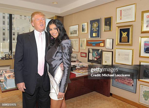 Donald Trump welcomes Miss USA 2010 Rima Fakih to his office in Trump Tower on May 20, 2010 in New York City.