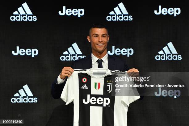 Juventus new signing Cristiano Ronaldo poses for the media during the press conference on July 16, 2018 in Turin, Italy.